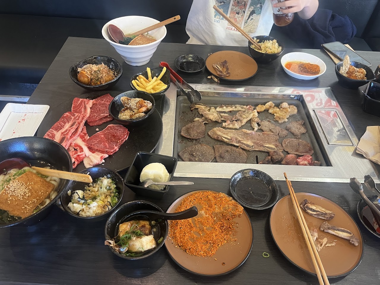 A full table of meats and sides at Matsusaka Backstreet